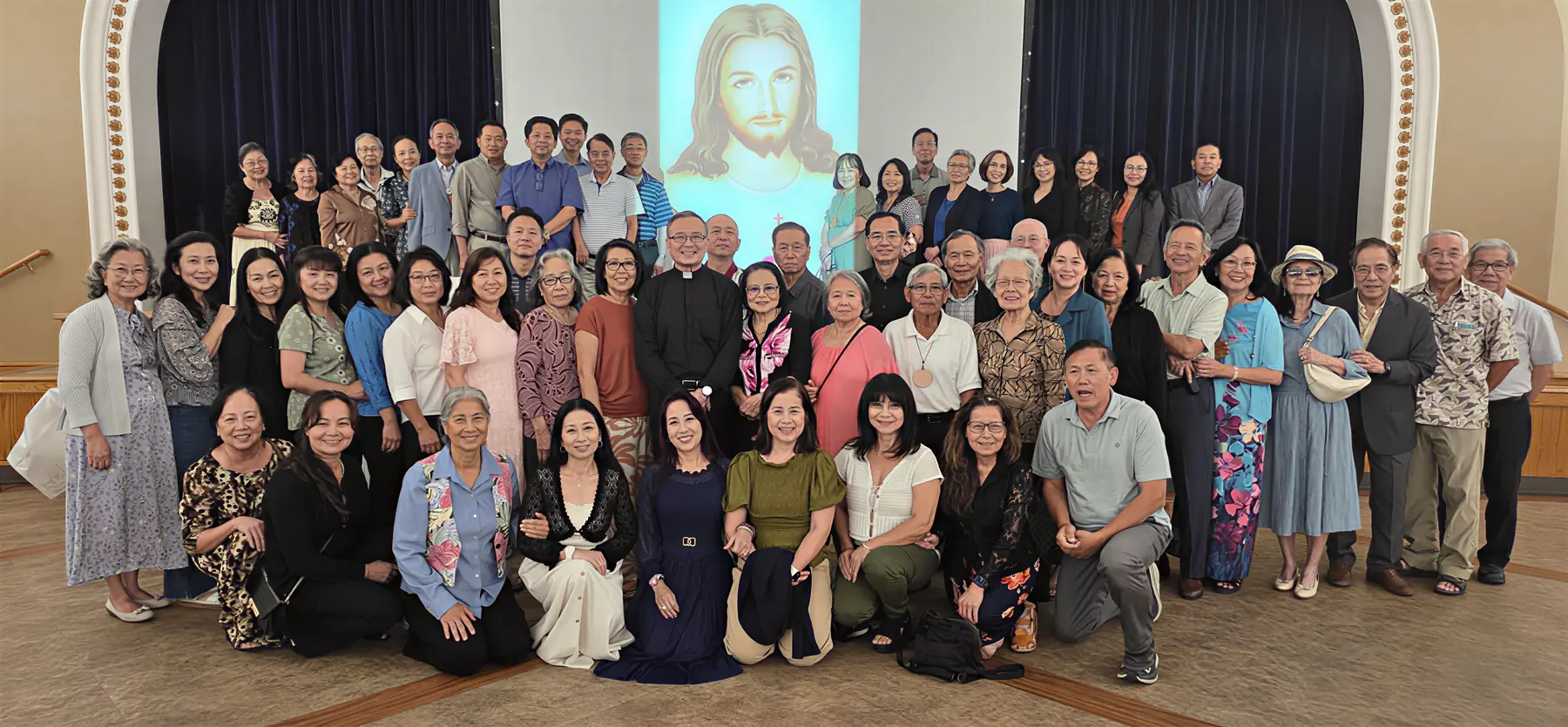 Families of the Marriage and Family Enrichment community gathered together for a group photograph